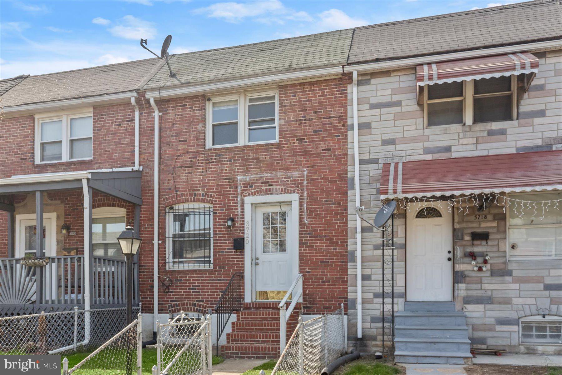 3720 St Victor Street Baltimore, MD 21225 - Photo 40 of 41 a front view of a house with glass door and furniture