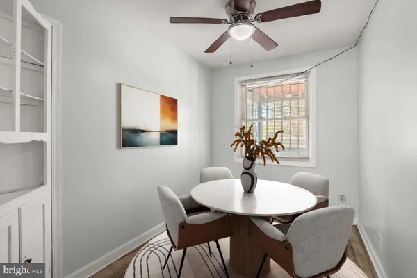a dining room with furniture and window