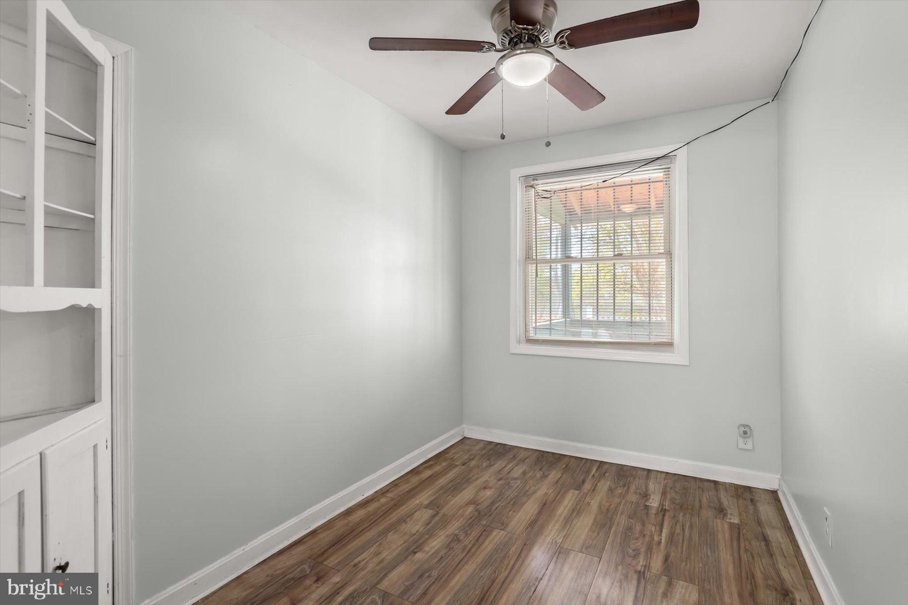 3720 St Victor Street Baltimore, MD 21225 - Photo 10 of 41 an empty room with a window and a fan