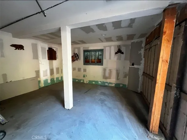 a view of a livingroom with wooden floor and a window