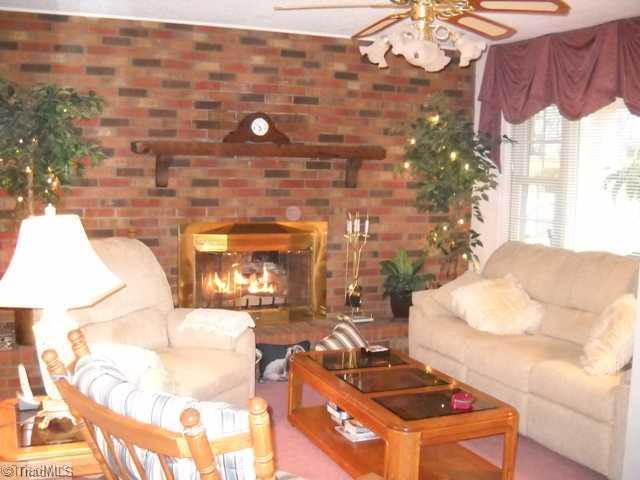 7105 Kingston Road Trinity, NC 27360 - Photo 4 of 16 Living Room. Lots of light from large windows in living room. Cozy gas logs, extra large hearth.