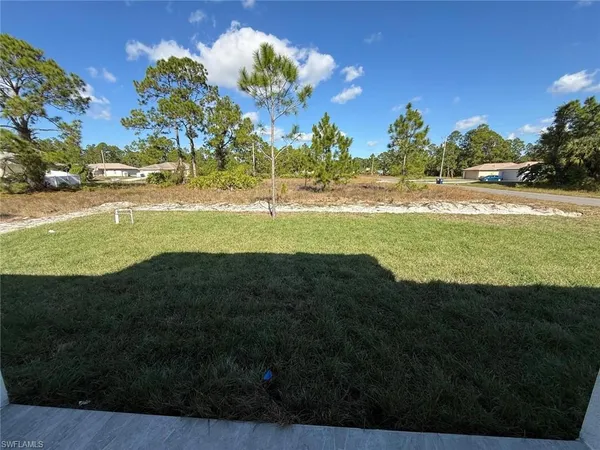 a view of an ocean and a yard