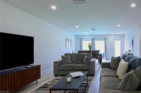 a bedroom with a bed and a lamp