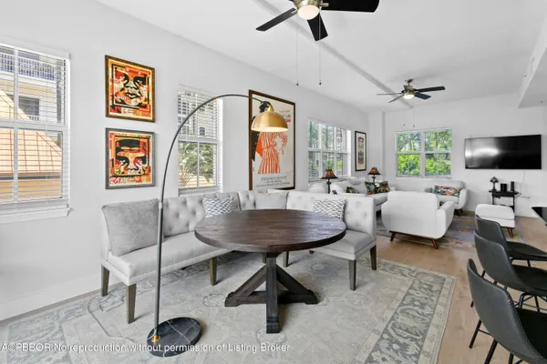 a kitchen with stainless steel appliances granite countertop a sink a stove and refrigerator