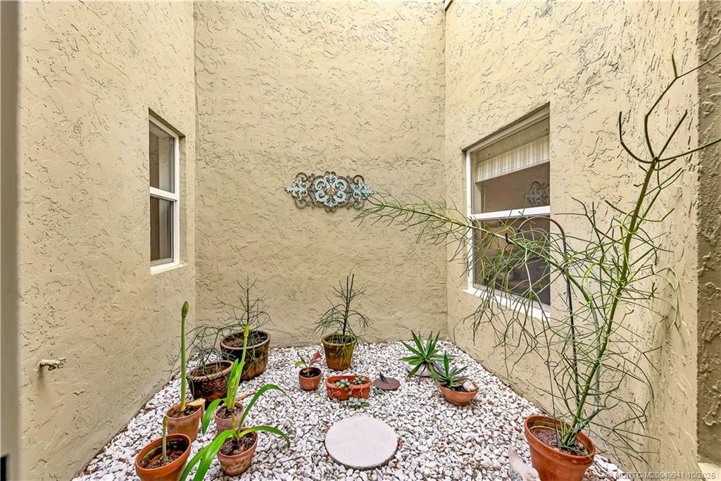 2437 Southwest Foxpoint Trail Palm City, FL 34990 - Photo 11 of 32 a bathroom with a sink and a mirror
