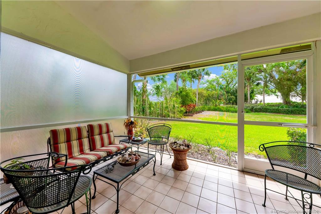 2437 Southwest Foxpoint Trail Palm City, FL 34990 - Photo 25 of 32 a outdoor view with a seating space