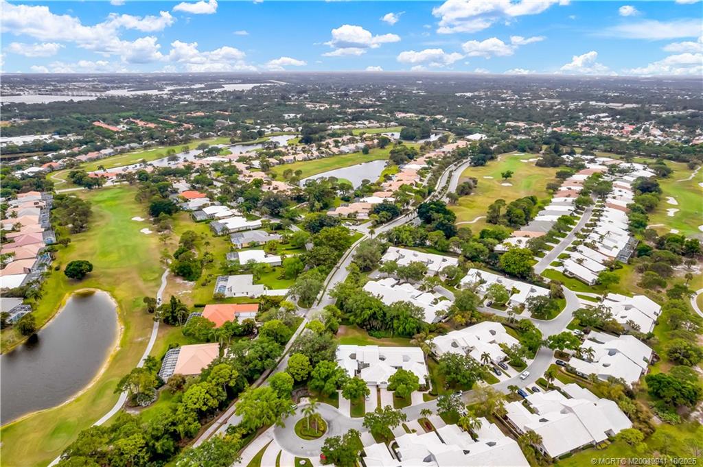 2437 Southwest Foxpoint Trail Palm City, FL 34990 - Photo 29 of 32 an aerial view of residential houses with outdoor space