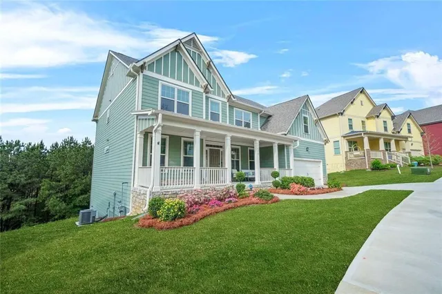a front view of house with yard and green space
