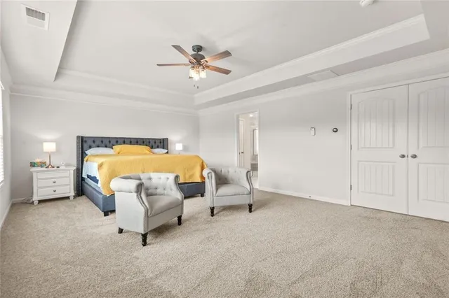 a view of walk in closet with clothes