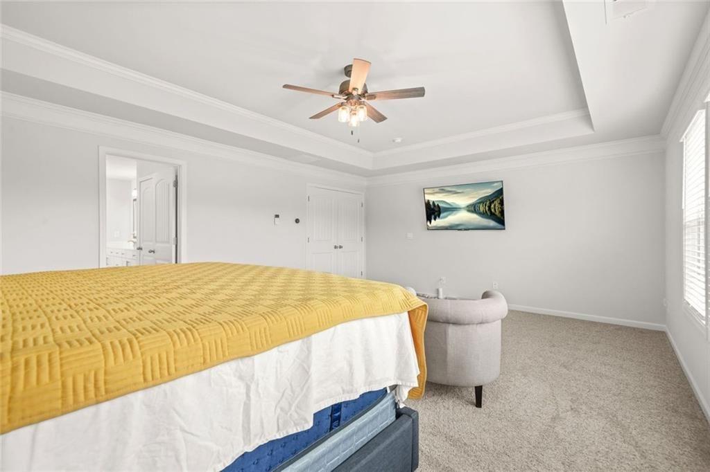 1606 Chancery Lane Lithia Springs, GA 30122 - Photo 20 of 66 a bedroom with a bed and a ceiling fan