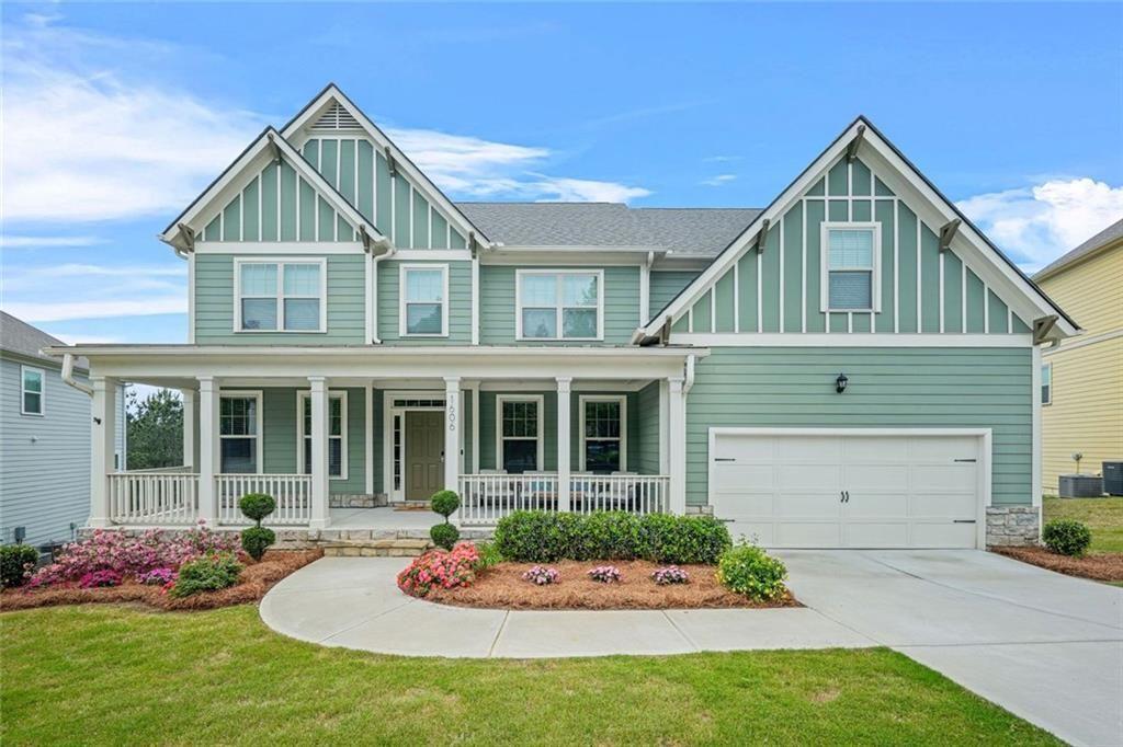 1606 Chancery Lane Lithia Springs, GA 30122 - Photo 2 of 66 a front view of a house with a yard and potted plants