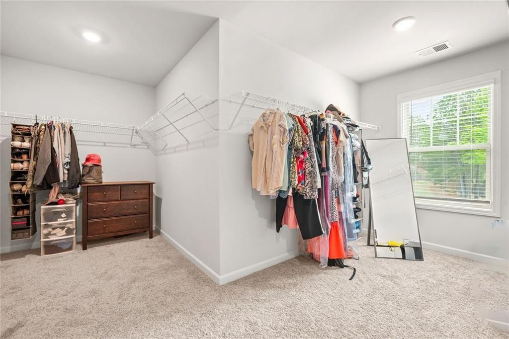 1606 Chancery Lane Lithia Springs, GA 30122 - Photo 21 of 66 a view of walk in closet with clothes
