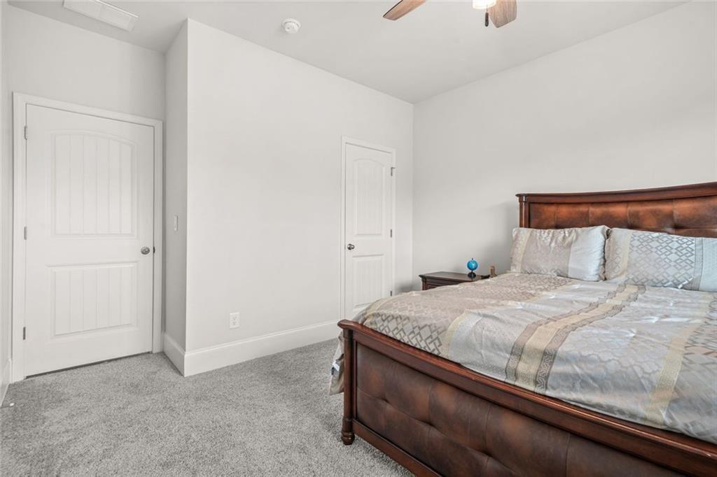 1606 Chancery Lane Lithia Springs, GA 30122 - Photo 22 of 66 a bedroom with a bed and a window