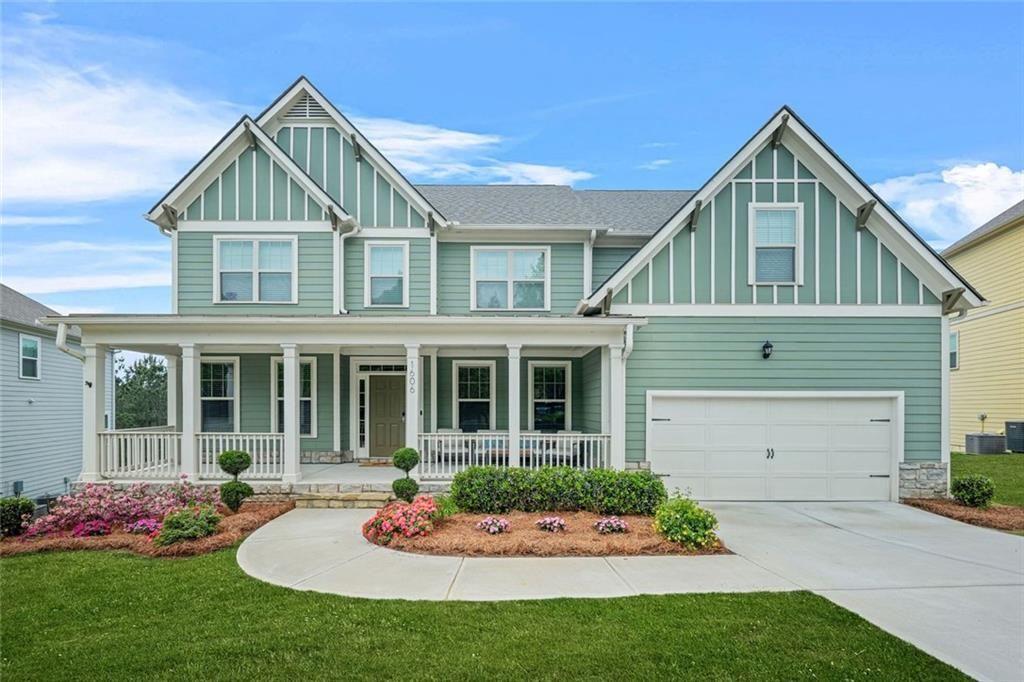1606 Chancery Lane Lithia Springs, GA 30122 - Photo 34 of 66 a front view of a house with a yard and potted plants