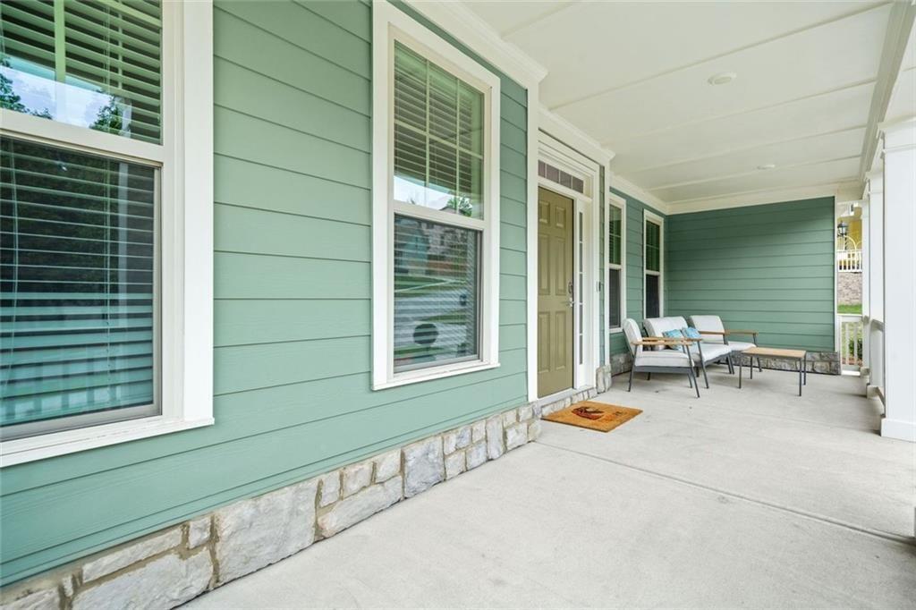 1606 Chancery Lane Lithia Springs, GA 30122 - Photo 35 of 66 a backyard of a house with table and chairs