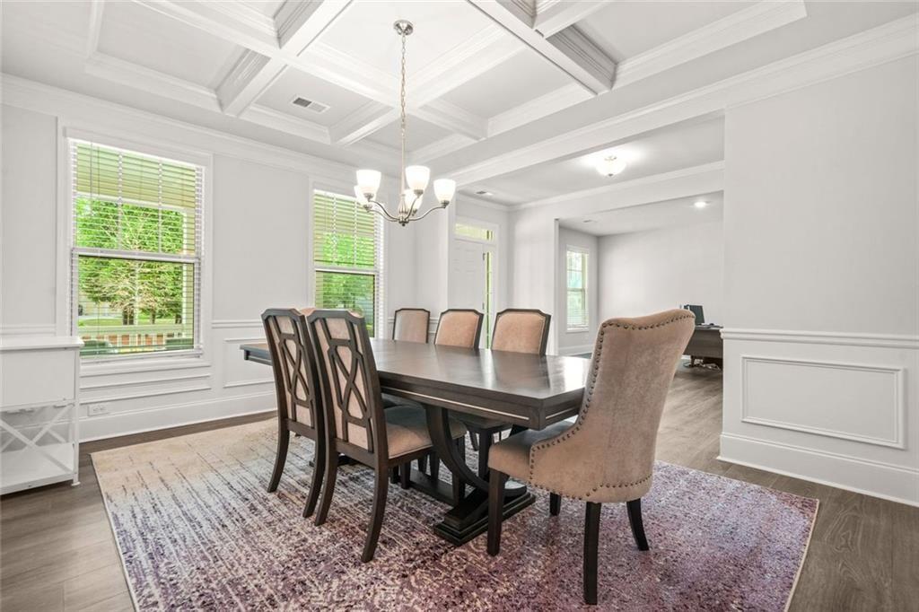 1606 Chancery Lane Lithia Springs, GA 30122 - Photo 38 of 66 a view of a a dining room with furniture window and wooden floor