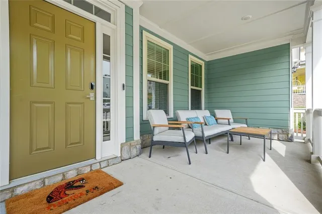 a patio with patio couch and table