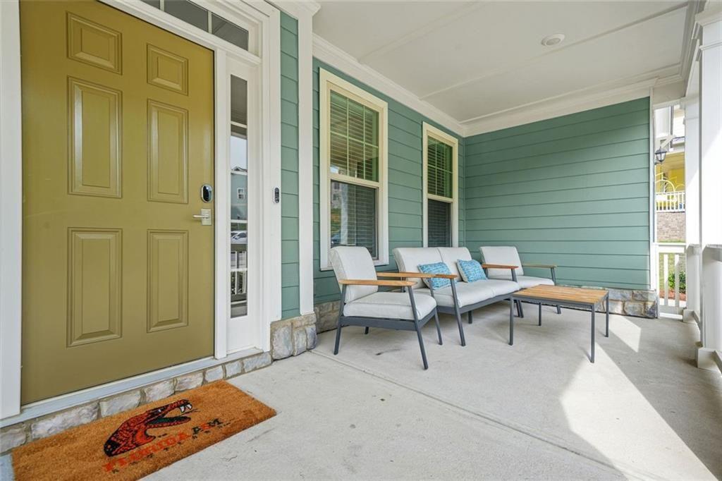 1606 Chancery Lane Lithia Springs, GA 30122 - Photo 4 of 66 a patio with patio couch and table