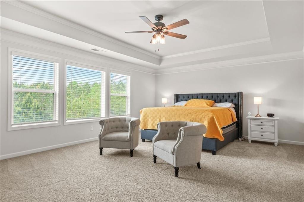 1606 Chancery Lane Lithia Springs, GA 30122 - Photo 44 of 66 a bedroom with a bed and a couch