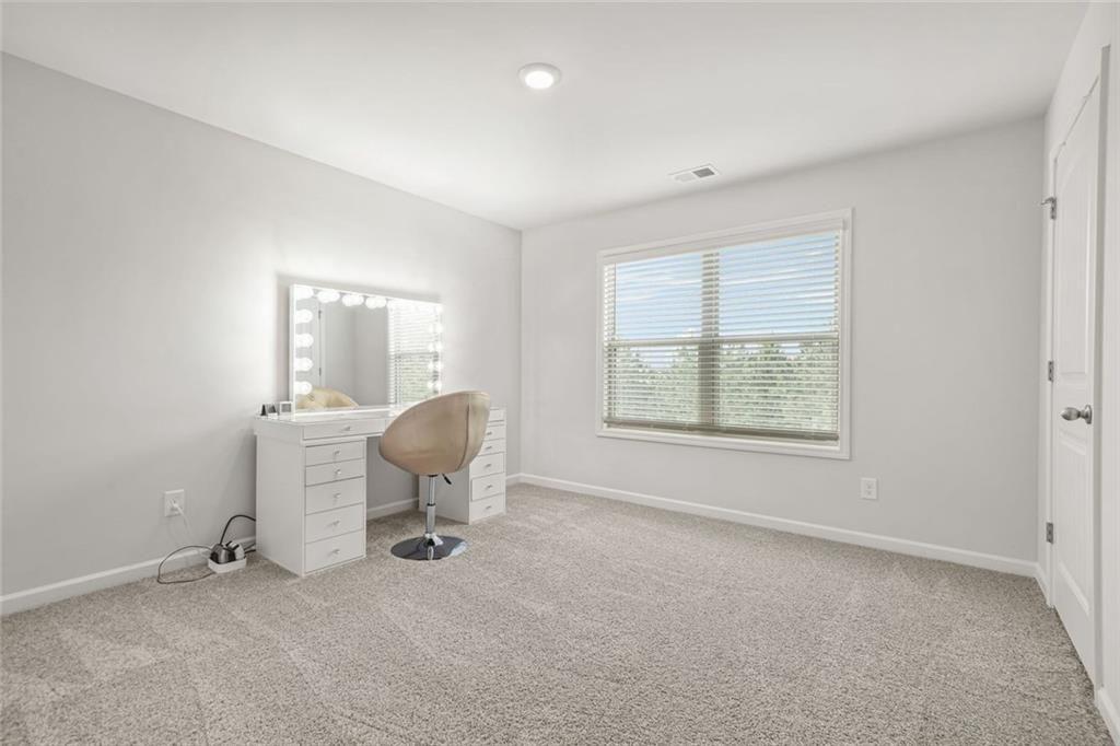 1606 Chancery Lane Lithia Springs, GA 30122 - Photo 53 of 66 wooden floor in an empty room with a window