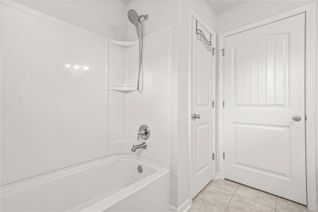 1606 Chancery Lane Lithia Springs, GA 30122 - Photo 54 of 66 a bathroom with a bathtub