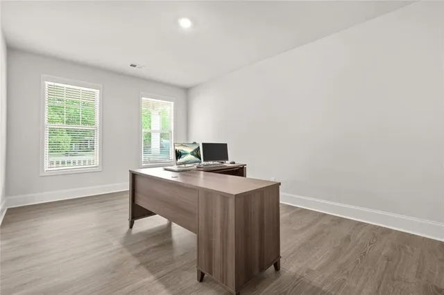 a workspace with furniture and window