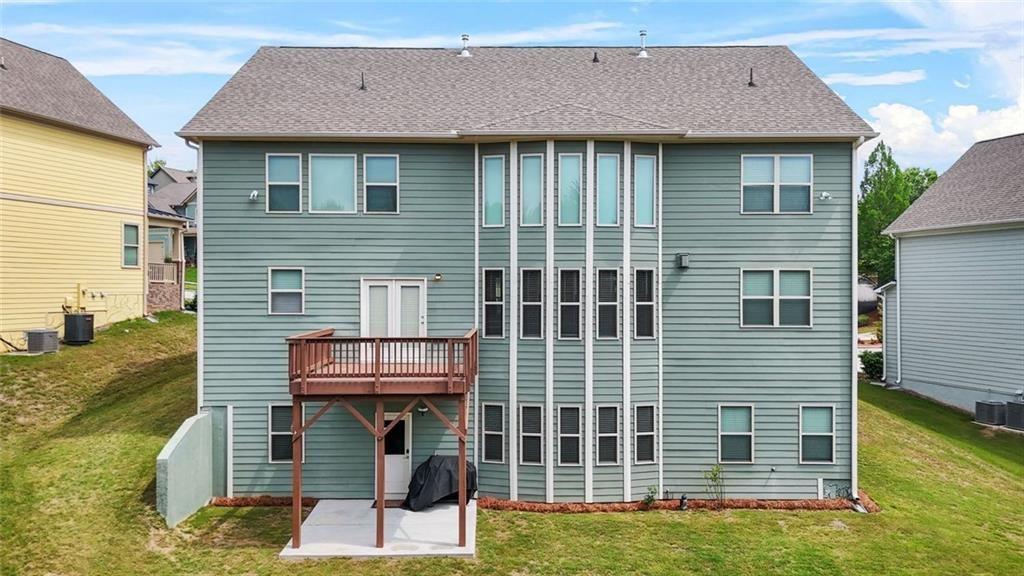 1606 Chancery Lane Lithia Springs, GA 30122 - Photo 64 of 66 a front view of a house with garden