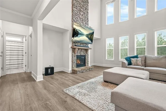 a living room with furniture window and wooden floor