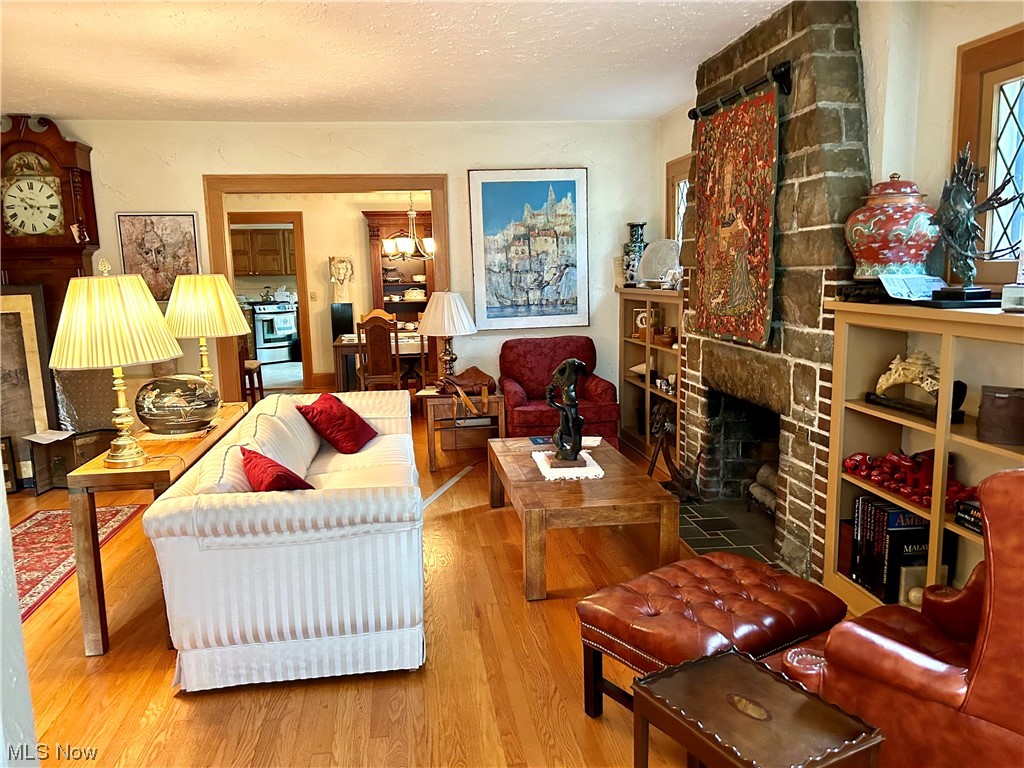 2920 Kent Road Silver Lake, OH 44224 - Photo 3 of 28 Hardwood floored living room featuring a fireplace