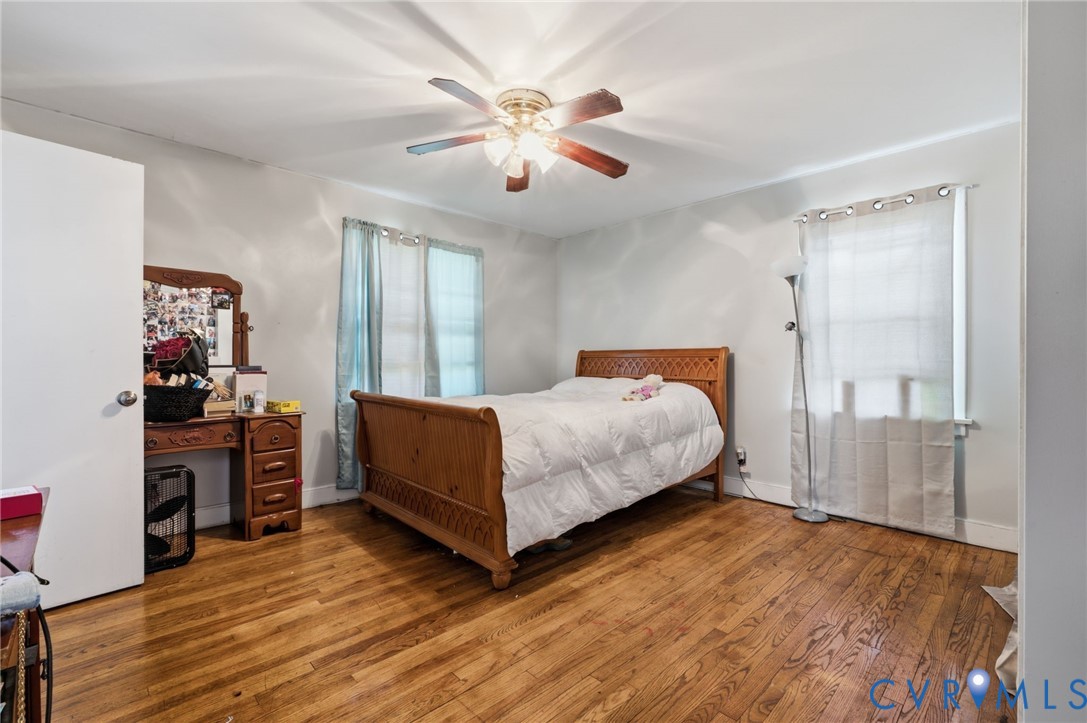 4021 Beulah Road Richmond, VA 23237 - Photo 23 of 27 Bedroom featuring wood-finish flooring, two window
