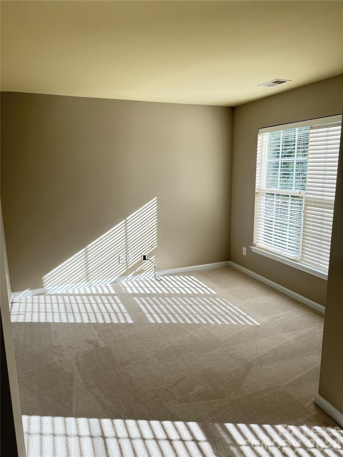 13518 Northbourne Road Huntersville, NC 28078 - Photo 7 of 15 a bedroom with a bed and a window