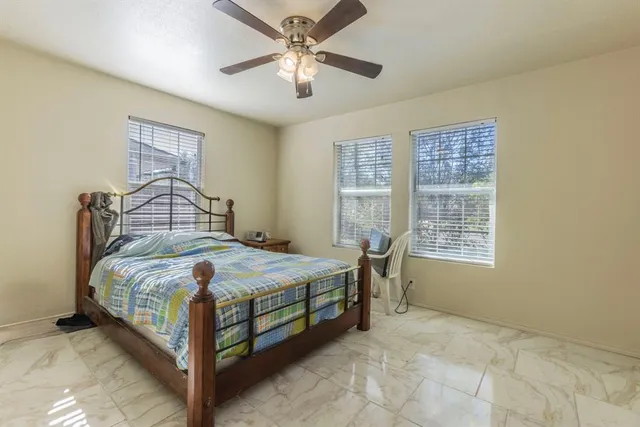 a bedroom with a bed and window