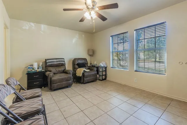 a living room with furniture and a window
