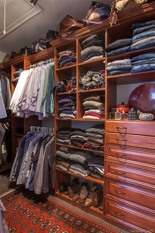 2220 Vail Avenue Charlotte, NC 28207 - Photo 11 of 23 a view of walk in closet with clothes and shoes