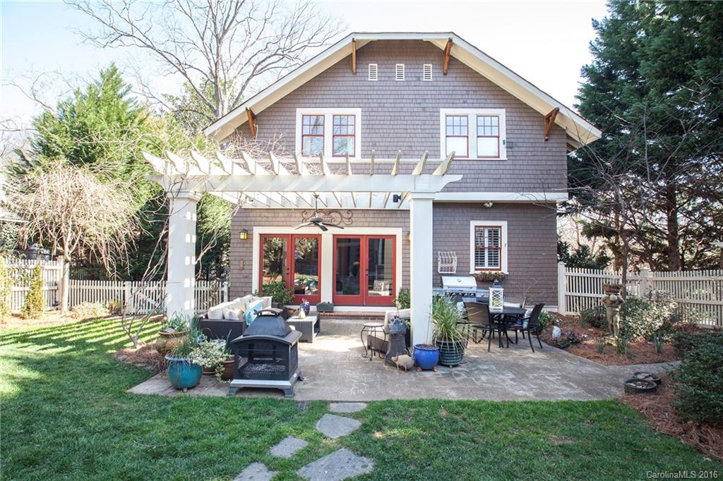 2220 Vail Avenue Charlotte, NC 28207 - Photo 19 of 23 a front view of a house with garden and chairs
