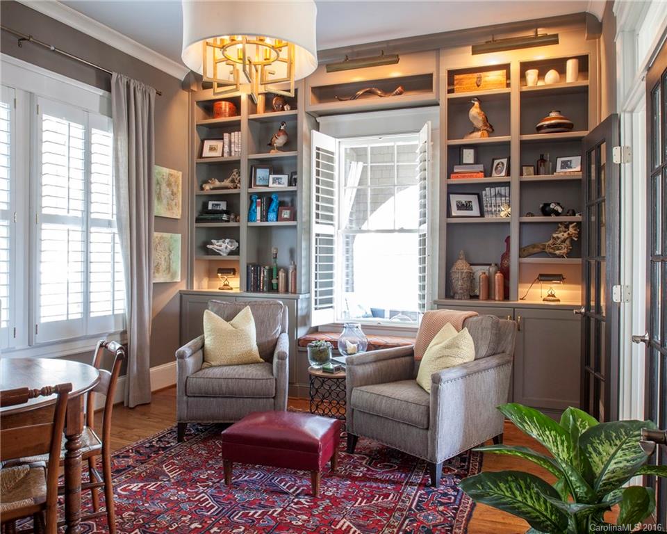 2220 Vail Avenue Charlotte, NC 28207 - Photo 5 of 23 a living room with furniture a bookshelf and a large window