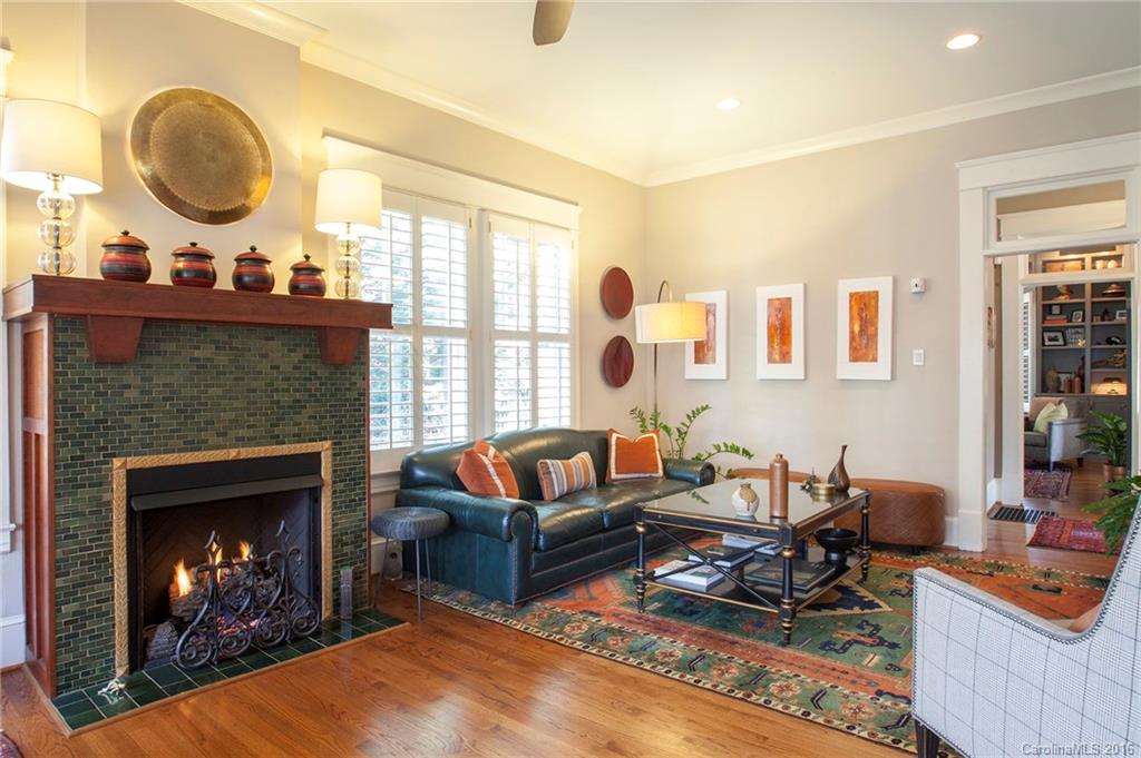 2220 Vail Avenue Charlotte, NC 28207 - Photo 6 of 23 a living room with furniture a fireplace and a large window