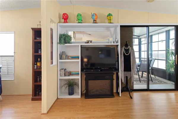 a hallway with a stove and a refrigerator