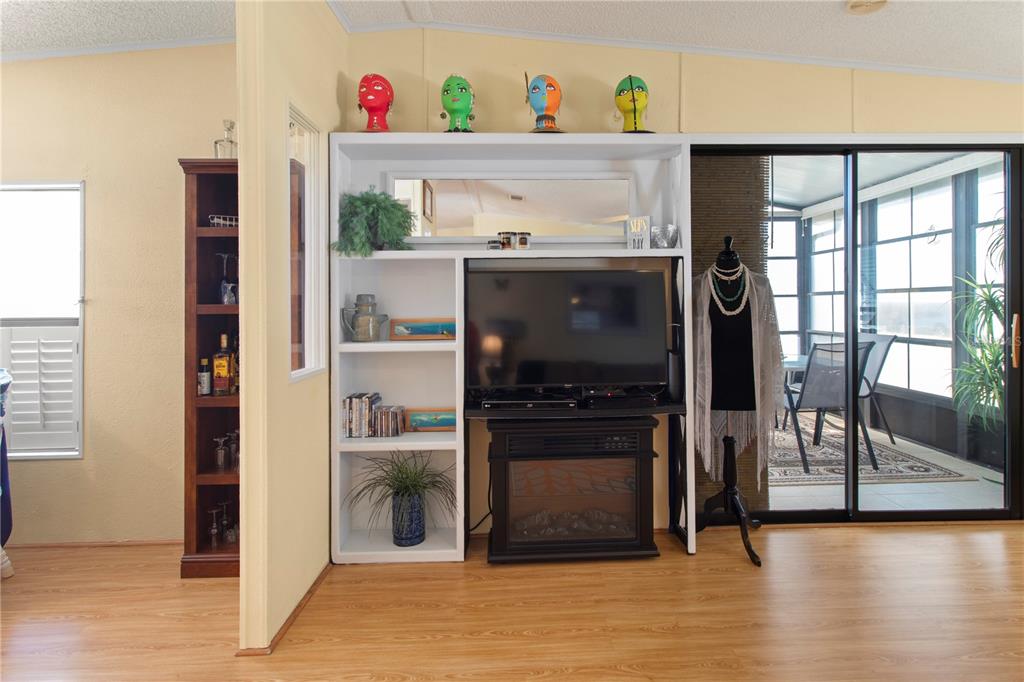 148 Nightingale Circle Ellenton, FL 34222 - Photo 16 of 47 a hallway with a stove and a refrigerator