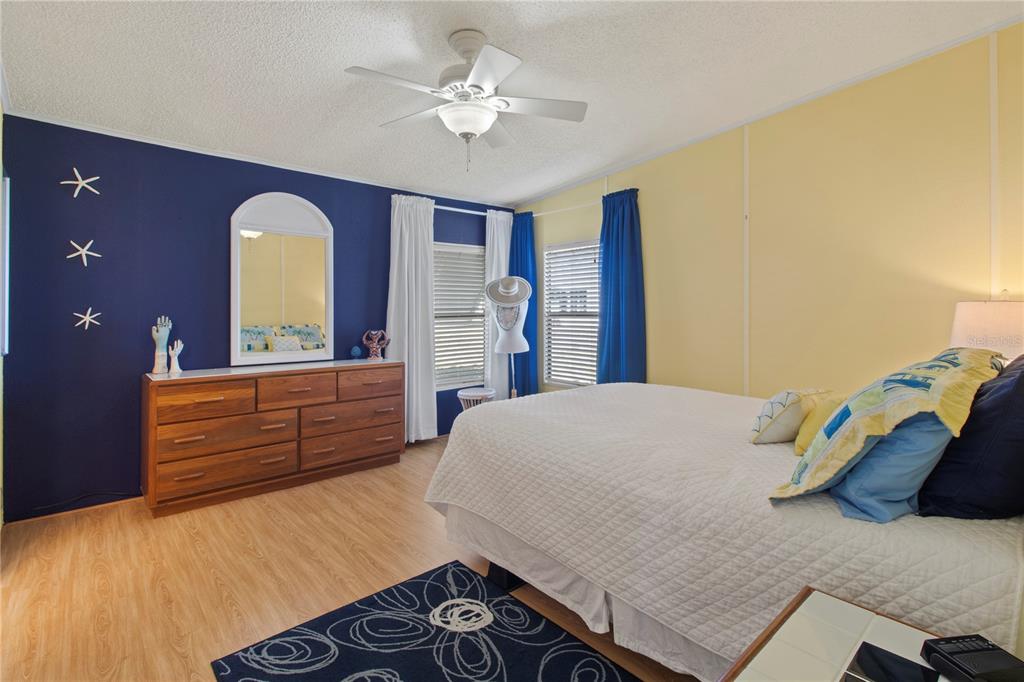148 Nightingale Circle Ellenton, FL 34222 - Photo 17 of 47 a bedroom with a bed and a dresser