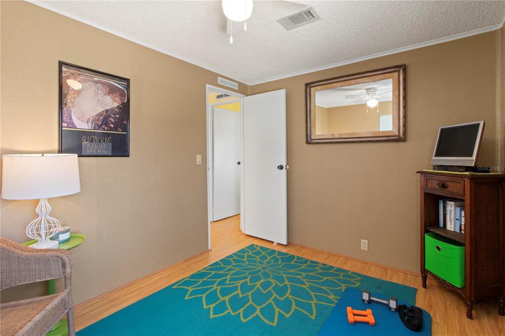 148 Nightingale Circle Ellenton, FL 34222 - Photo 22 of 47 a bedroom with a bed and a window