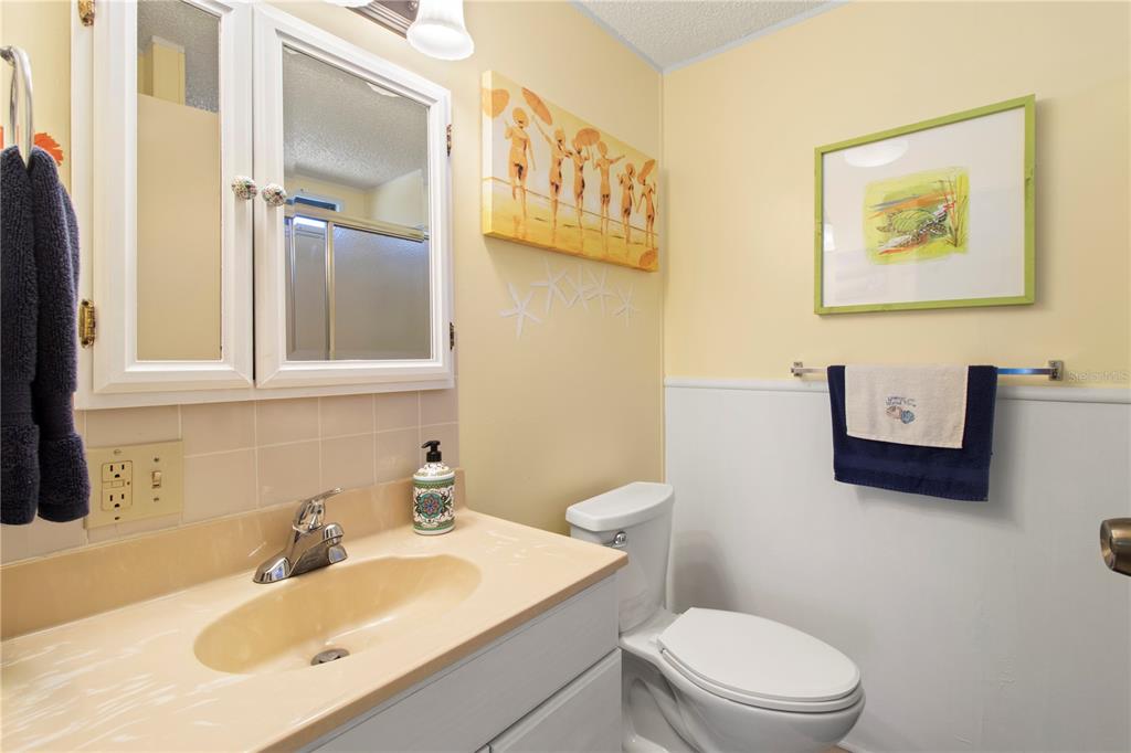 148 Nightingale Circle Ellenton, FL 34222 - Photo 23 of 47 a bathroom with a sink mirror vanity and toilet