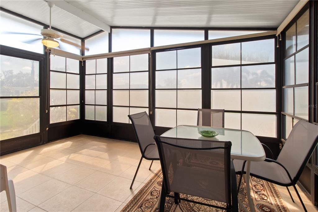148 Nightingale Circle Ellenton, FL 34222 - Photo 25 of 47 a view of a dining room with furniture and a window