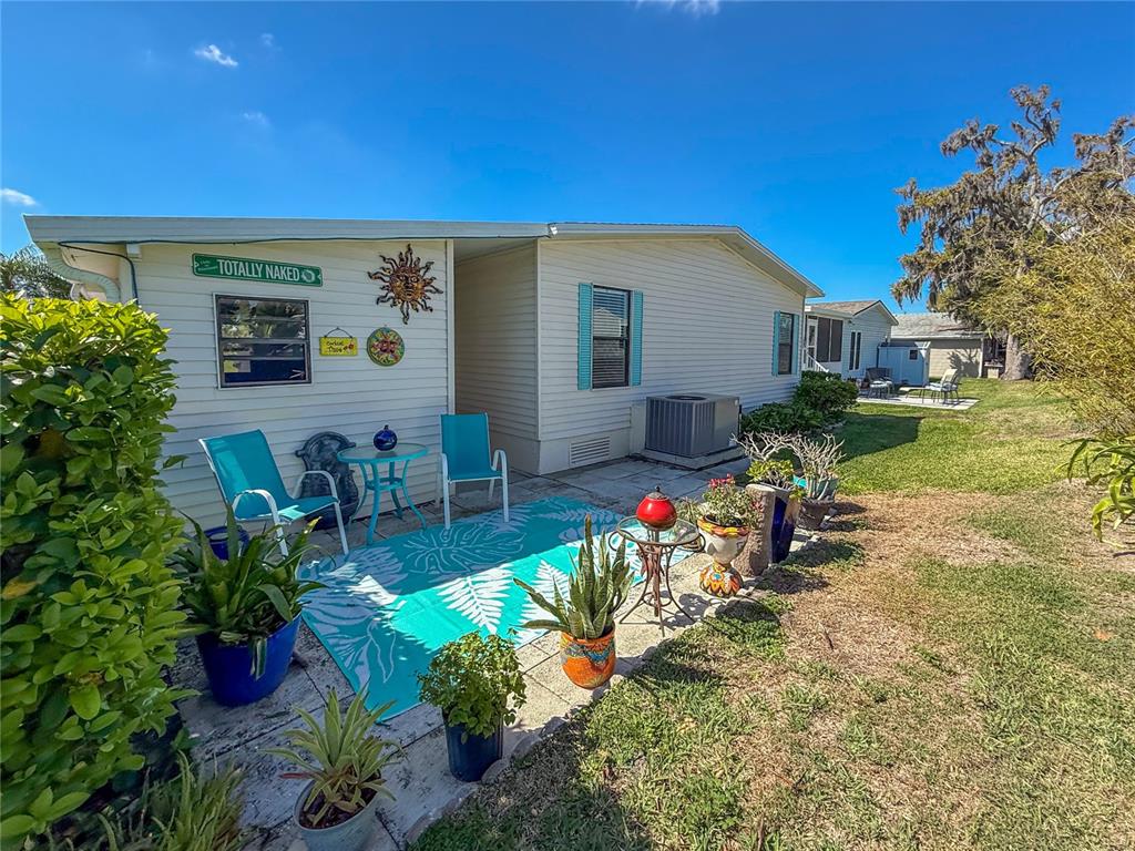 148 Nightingale Circle Ellenton, FL 34222 - Photo 30 of 47 a view of a house with backyard sitting area and garden