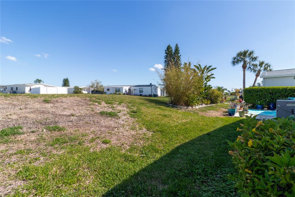 148 Nightingale Circle Ellenton, FL 34222 - Photo 32 of 47 a view of a yard with a house
