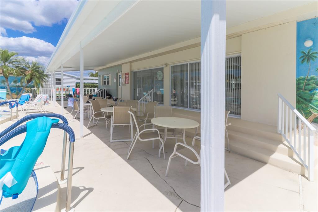 148 Nightingale Circle Ellenton, FL 34222 - Photo 41 of 47 a view of a swimming pool with outdoor seating and patio