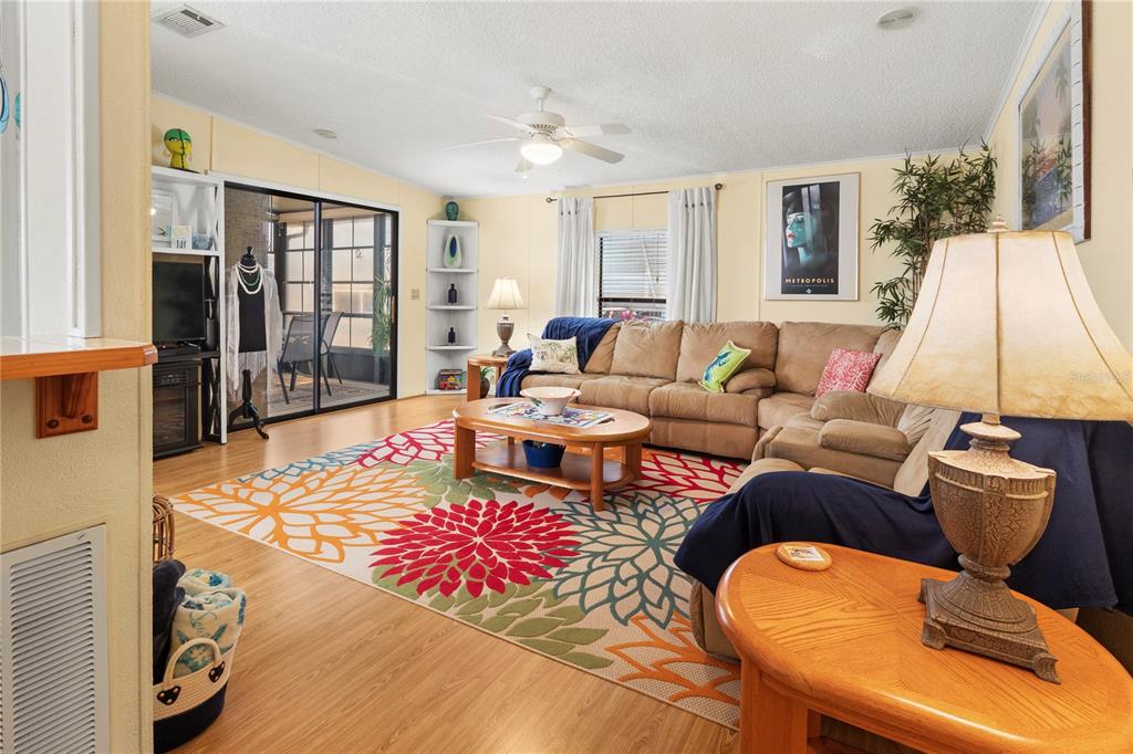 148 Nightingale Circle Ellenton, FL 34222 - Photo 6 of 47 a living room with furniture and wooden floor
