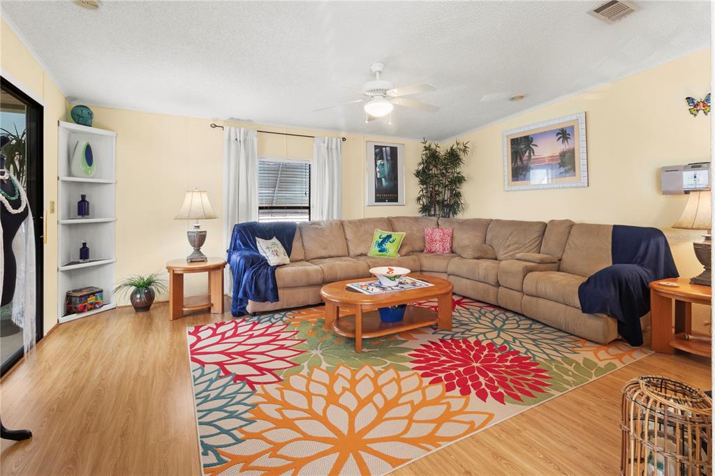 148 Nightingale Circle Ellenton, FL 34222 - Photo 7 of 47 a living room with furniture and wooden floor