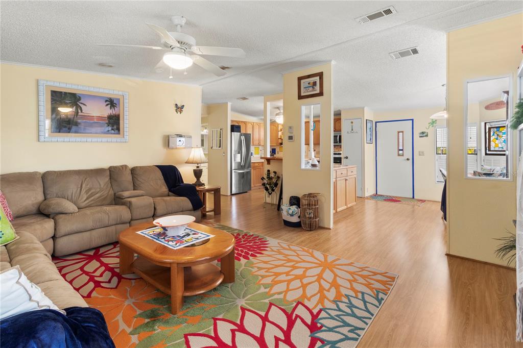 148 Nightingale Circle Ellenton, FL 34222 - Photo 8 of 47 a living room with furniture and wooden floor