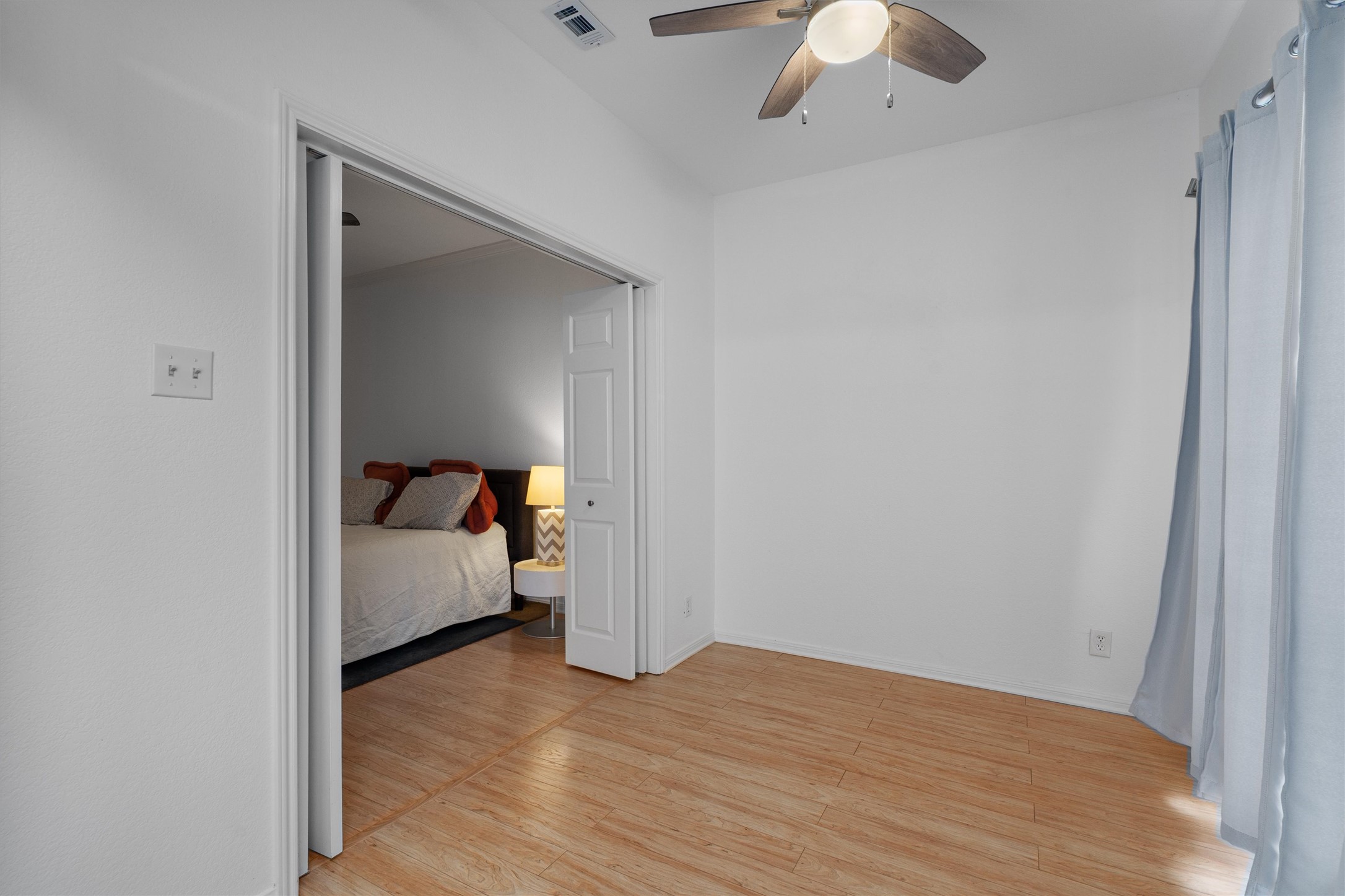 3840 Far W Boulevard, Unit 206 Austin, TX 78731 - Photo 11 of 20 A bonus flex space can be accessed from the main living area or the primary suite. Leave the doors open to the suite for a Peloton corner or extra closet space. Close it off, and make it an office or lounge area.